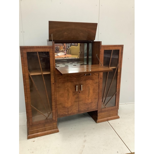 1001 - An Art Deco figured walnut cocktail cabinet, width 136cm, depth 39cm, height 123cm. Condition - one ... 