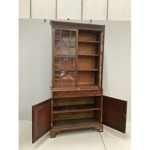 1006 - A George III style mahogany bookcase, width 105cm, depth 40cm, height 217cm. Condition - good