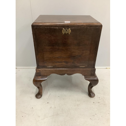 1010 - An early 20th century George II style oak record cabinet on cabriole legs, width 59cm, depth 45cm, h... 