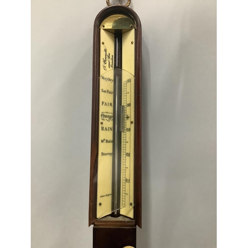 1014 - A reproduction mahogany ship's barometer, by A. Comitti & Son, London, on brass gimbal, height 93cm.... 