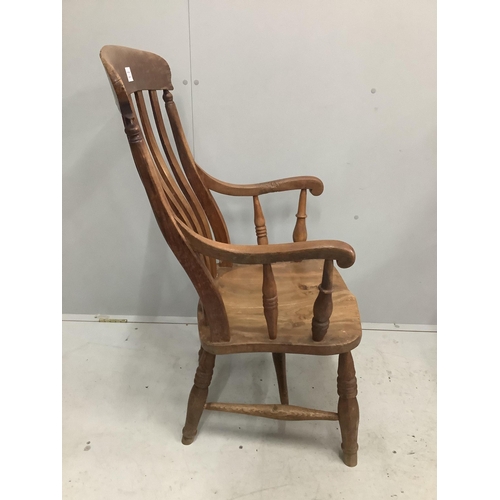 1024 - A Victorian elm and beech Windsor lathe back elbow chair, width 53cm, depth 44cm, height 104cm. Cond... 