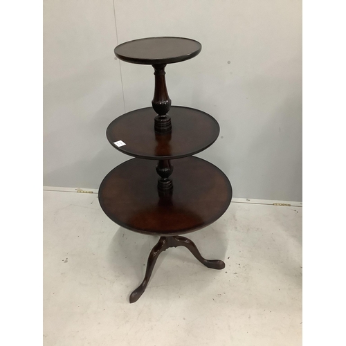 1029 - A George III style mahogany three tier dumb waiter, height 112cm. Condition - fair