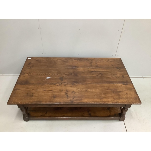 1060 - A large reproduction rectangular oak two tier coffee table, width 152cm, depth 92cm, height 49cm. Co... 