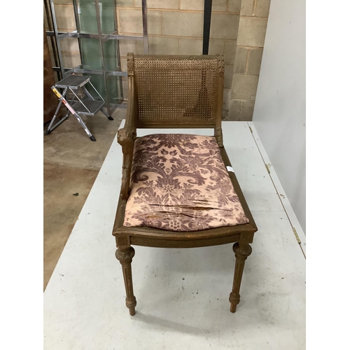 1061 - A Louis XVI style painted and giltwood caned seat, width 75cm, depth 44cm, height 84cm. Condition - ... 