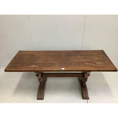 1077 - An 18th century style rectangular oak refectory dining table, on shaped end standards, width 176cm, ... 