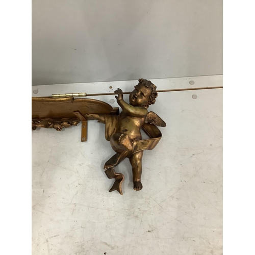 1116 - An 18th century style gilt composition cherub wall bracket, width 95cm. Condition - poor to fair... 