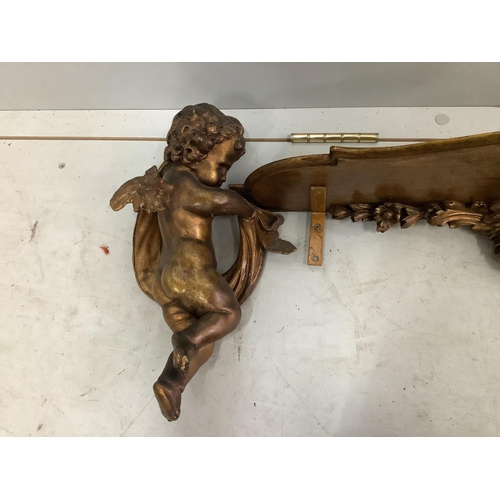 1116 - An 18th century style gilt composition cherub wall bracket, width 95cm. Condition - poor to fair... 