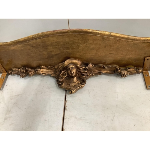 1116 - An 18th century style gilt composition cherub wall bracket, width 95cm. Condition - poor to fair... 