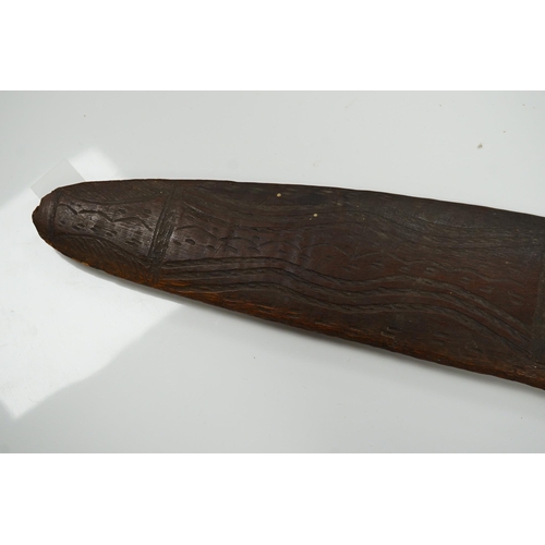 2206 - An Aboriginal boomerang, engraved to one side, 76cm wide. Condition - fair to good