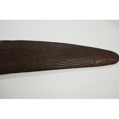 2206 - An Aboriginal boomerang, engraved to one side, 76cm wide. Condition - fair to good