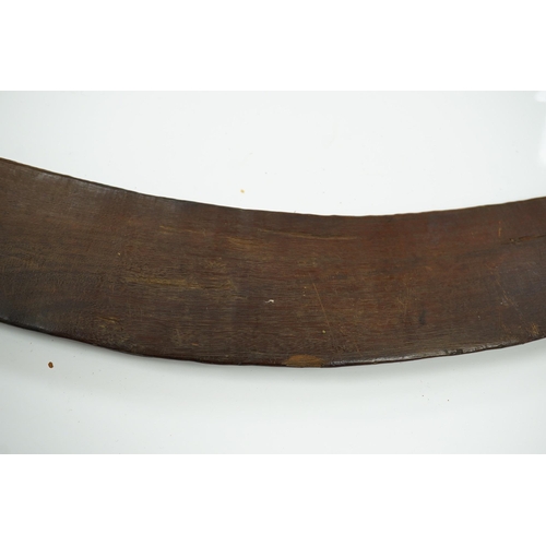 2206 - An Aboriginal boomerang, engraved to one side, 76cm wide. Condition - fair to good