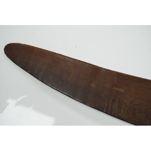 2206 - An Aboriginal boomerang, engraved to one side, 76cm wide. Condition - fair to good