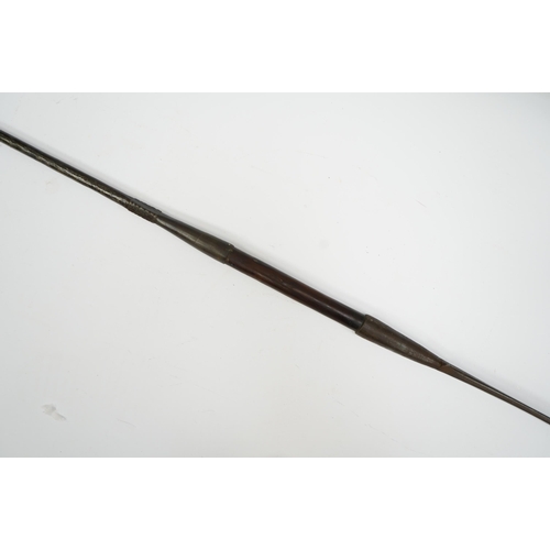 2207 - An African spear, with elongated iron tip and short hardwood shaft, 185cm. Condition fair to good, w... 