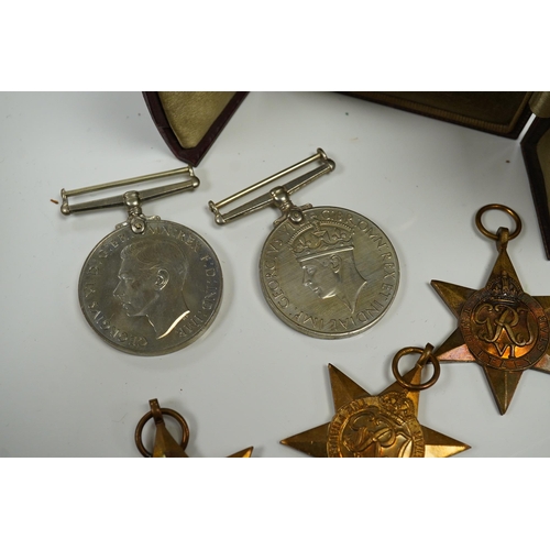 2208 - Five WWII medals including the Italy star, the France and Germany star, etc. and a cased miniature o... 