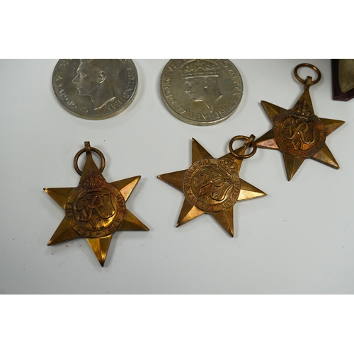 2208 - Five WWII medals including the Italy star, the France and Germany star, etc. and a cased miniature o... 