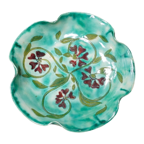 411 - A Della Robbia green glazed floral dish, 19cm diameter. Condition - good.