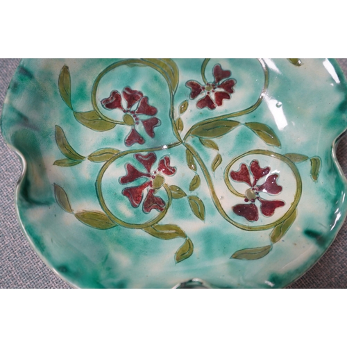 411 - A Della Robbia green glazed floral dish, 19cm diameter. Condition - good.