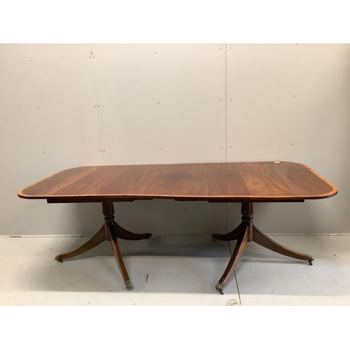 98 - A George IV satinwood banded mahogany twin pedestal dining table, 223cm extended, one spare leaf, de... 