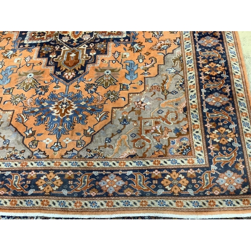 99 - A North West Persian peach ground carpet, 270 x 204cm. Condition - fair