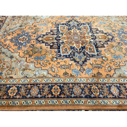 99 - A North West Persian peach ground carpet, 270 x 204cm. Condition - fair