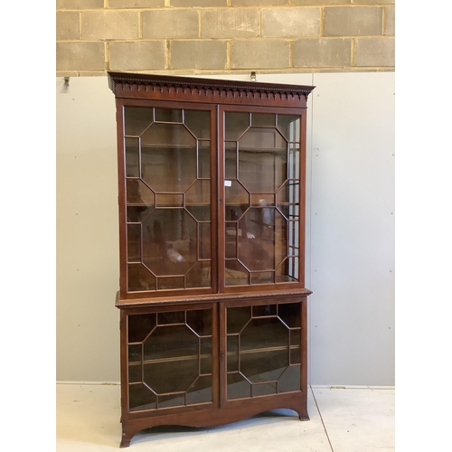 1006 - A George III style mahogany bookcase, enclosed by two pairs of astragal glazed doors, width 122cm, d... 