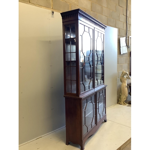 1006 - A George III style mahogany bookcase, enclosed by two pairs of astragal glazed doors, width 122cm, d... 