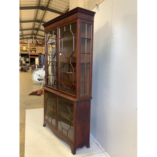 1006 - A George III style mahogany bookcase, enclosed by two pairs of astragal glazed doors, width 122cm, d... 