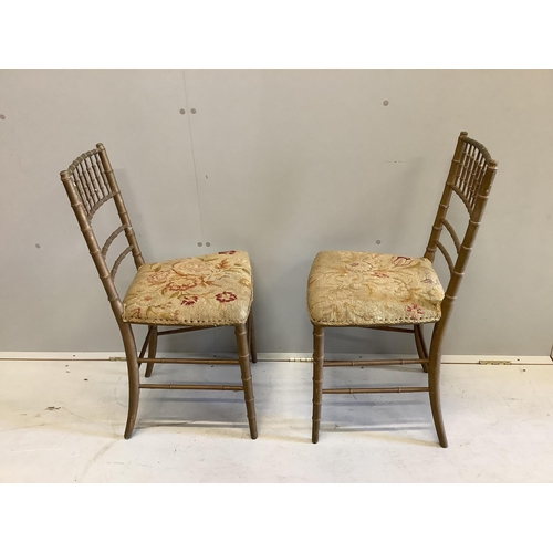 1011 - A pair of early 20th century gold painted faux bamboo tapestry seat ballroom chairs, height 83cm. Co... 