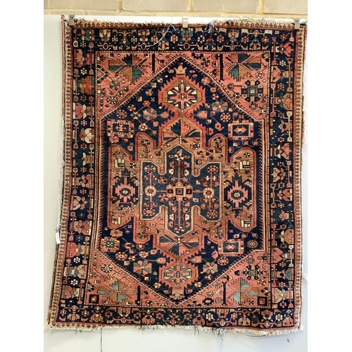 1064 - A Hamadan pink ground rug with a geometric woven hexagonal field, 195 x 156cm. Condition -  poor to ... 