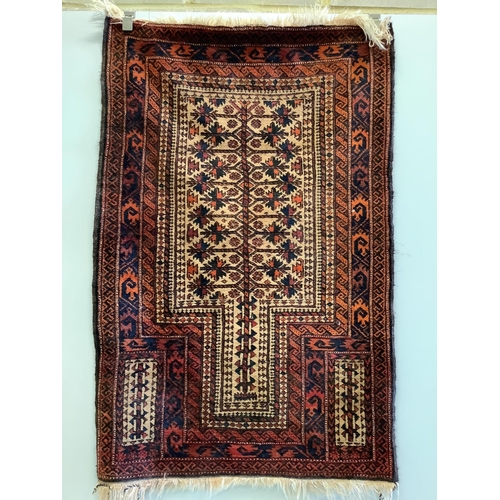 1089 - A Belouch red ground prayer rug, 142 x 96cm. Condition - fair