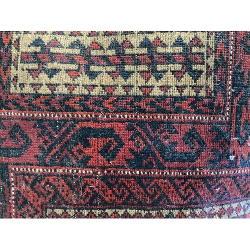 1089 - A Belouch red ground prayer rug, 142 x 96cm. Condition - fair