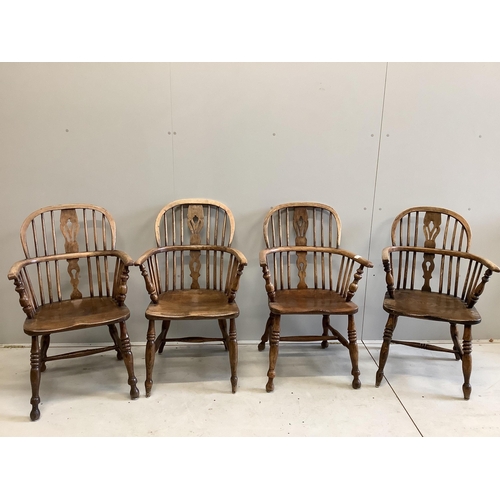 1092 - A harlequin set of four 19th century ash, elm and beech Windsor elbow chairs, largest width 60cm, de... 