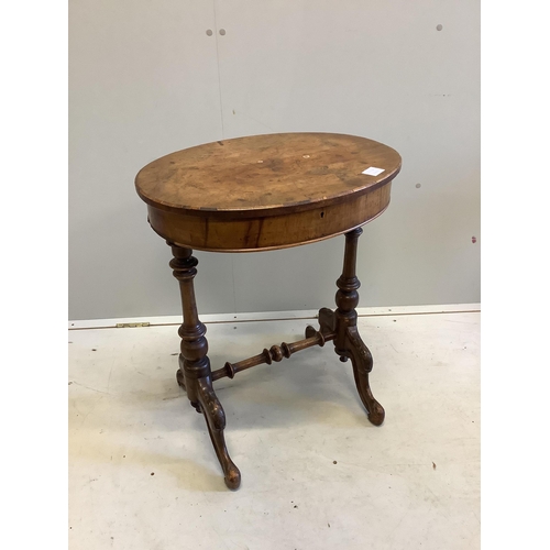 1100 - A Victorian oval walnut topped work table, width 56cm, depth 44cm, height 68cm. Condition - fair... 