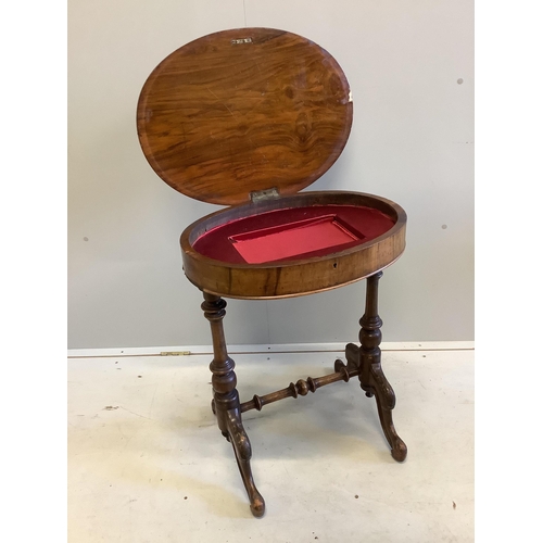 1100 - A Victorian oval walnut topped work table, width 56cm, depth 44cm, height 68cm. Condition - fair... 