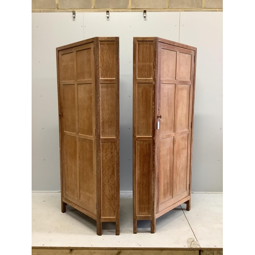 1109 - Heal & Son Ltd. A pair of weathered oak corner wardrobes, width 94cm, depth 53cm, height 182cm. Cond... 