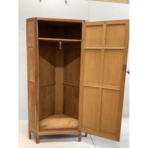 1109 - Heal & Son Ltd. A pair of weathered oak corner wardrobes, width 94cm, depth 53cm, height 182cm. Cond... 