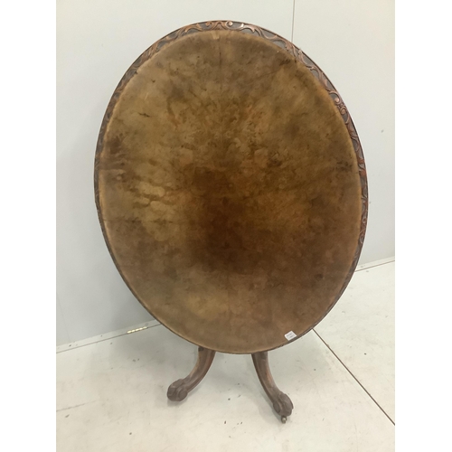 15 - A Victorian carved walnut oval tilt top breakfast table, 120 x 92cm, height 72cm. Condition - fair... 