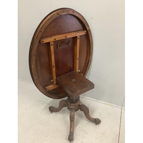 15 - A Victorian carved walnut oval tilt top breakfast table, 120 x 92cm, height 72cm. Condition - fair... 