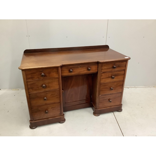 23 - A Victorian mahogany kneehole desk, fitted nine small drawers, width 125cm, height 78cm. Condition -... 