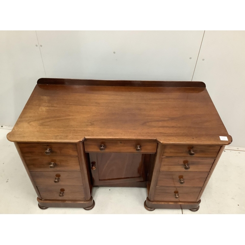 23 - A Victorian mahogany kneehole desk, fitted nine small drawers, width 125cm, height 78cm. Condition -... 