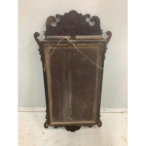 26 - A George III style parcel gilt mahogany fret cut wall mirror, width 44cm, height 86cm. Condition - f... 