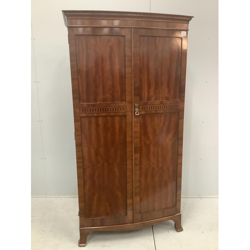 45 - An Edwardian inlaid mahogany bowfront wardrobe, Maple & Co label, width 96cm, depth 53cm, height 182... 