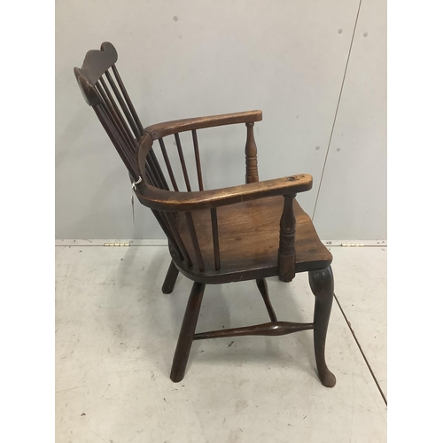 51 - An early 18th century ash and elm primitive Windsor elbow chair on cabriole front legs, width 52cm, ... 