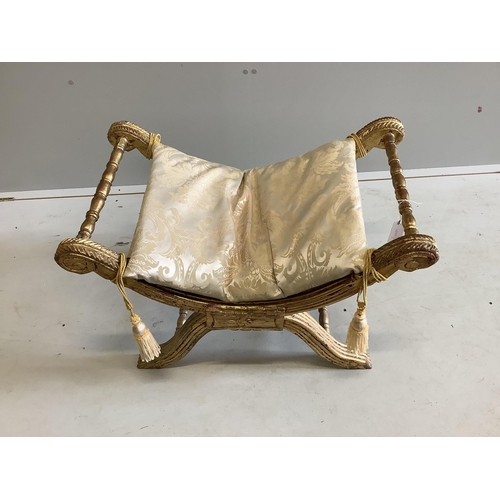 9 - An 18th century style giltwood X frame dressing stool, width 76cm, depth 46cm, height 53cm. Conditio... 