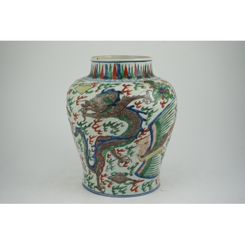 105 - A Chinese wucai dragon and phoenix baluster jar, Transitional, Shunzhi period (1644-1661), painted... 