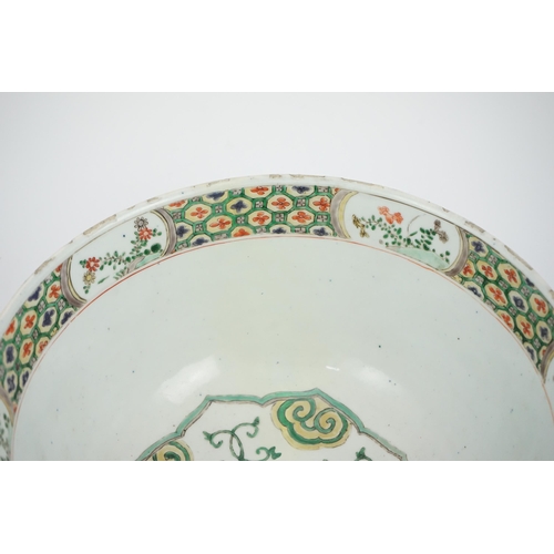 108 - A large Chinese famille verte bowl, Kangxi period (1662-1722), the panelled exterior painted with re... 