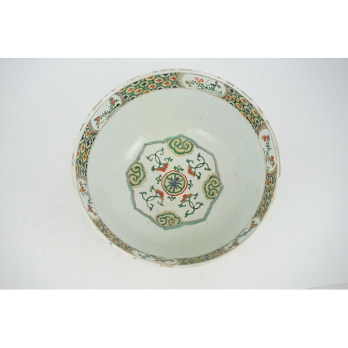 108 - A large Chinese famille verte bowl, Kangxi period (1662-1722), the panelled exterior painted with re... 