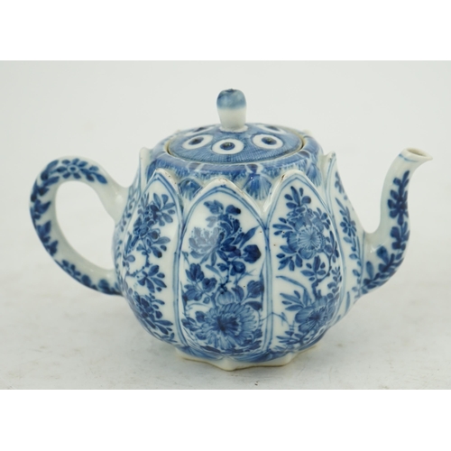 118 - A Chinese blue and white lotus pod-shaped teapot and cover, Kangxi period, the eight side panels pai... 