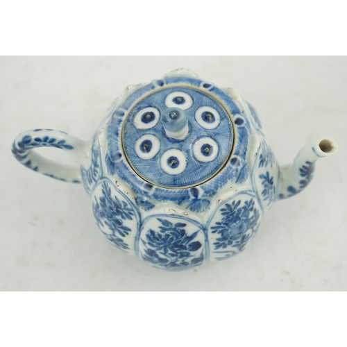 118 - A Chinese blue and white lotus pod-shaped teapot and cover, Kangxi period, the eight side panels pai... 