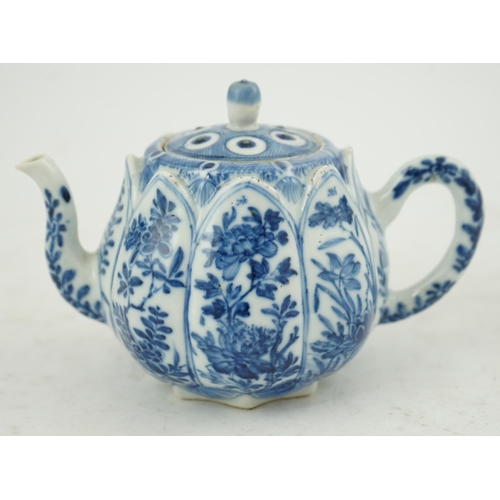 118 - A Chinese blue and white lotus pod-shaped teapot and cover, Kangxi period, the eight side panels pai... 